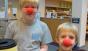 Two DeMotte patrons with red clown noses - part of put your nose in a book.