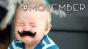 Baby with fake mustache. Hashtag Movember.